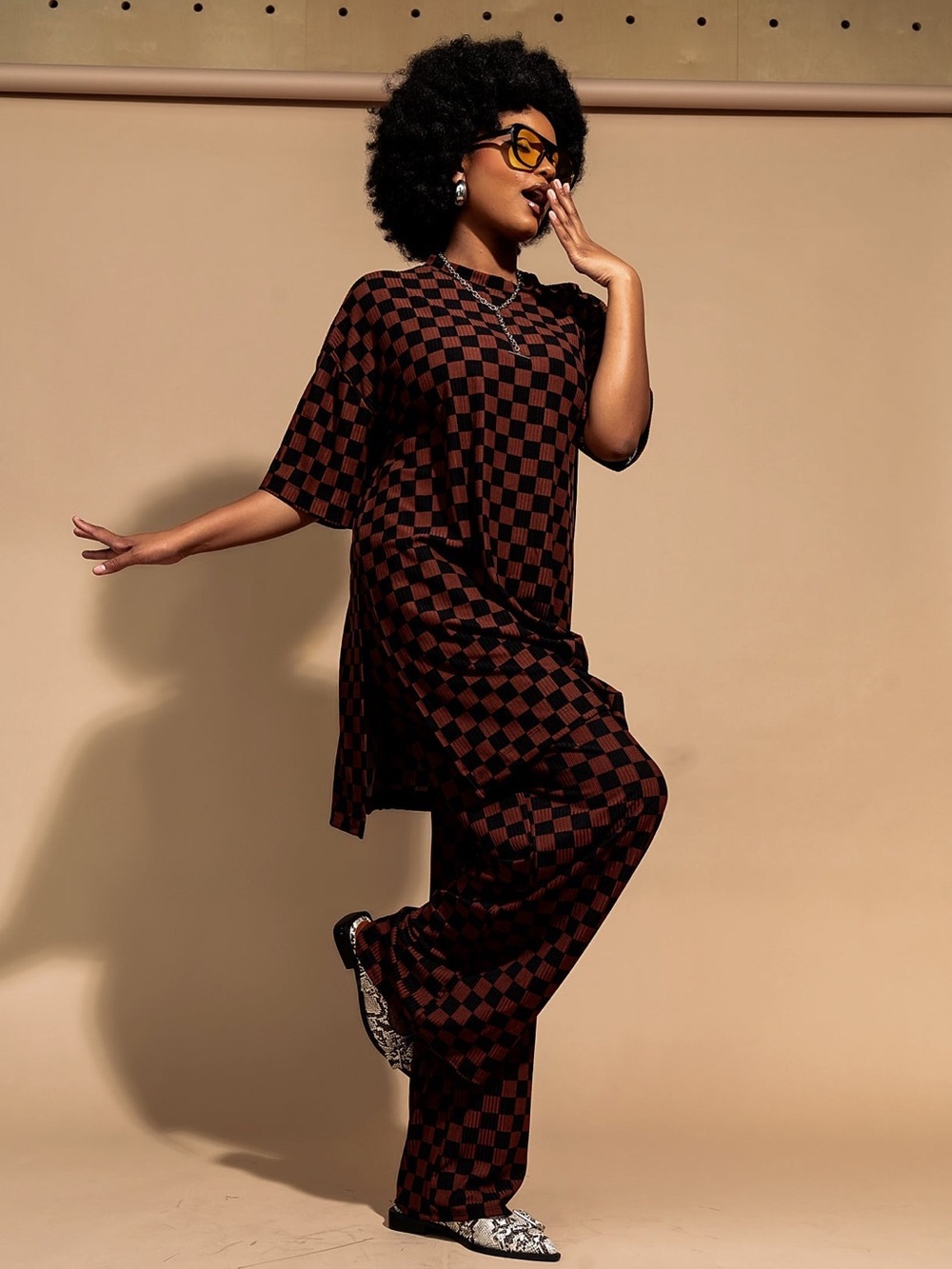 Dressed in LALA Leveled Up Ribbed Playsuit in Black + Mocha Checkerboard - M